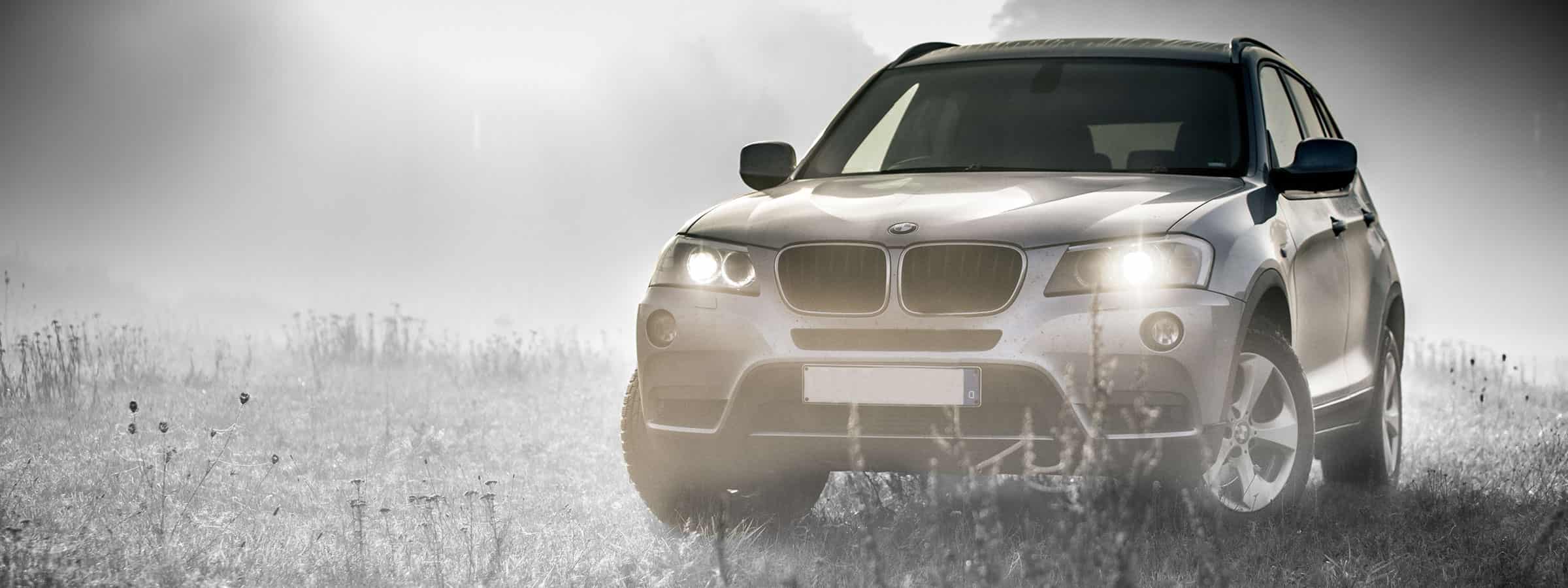 SUV with headlights on
